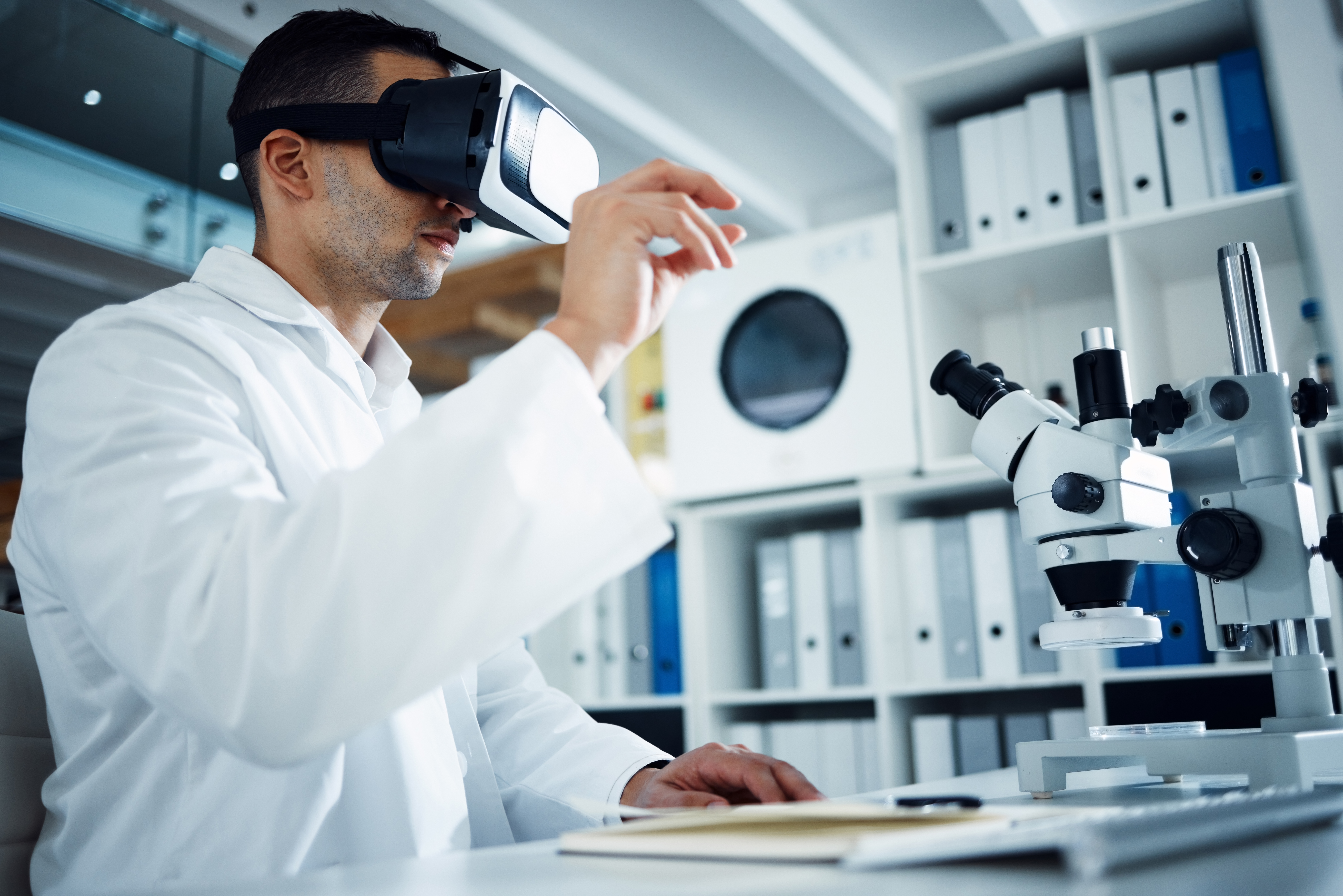 Shot of a scientist using a virtual reality headset while conducting research in a laboratory
